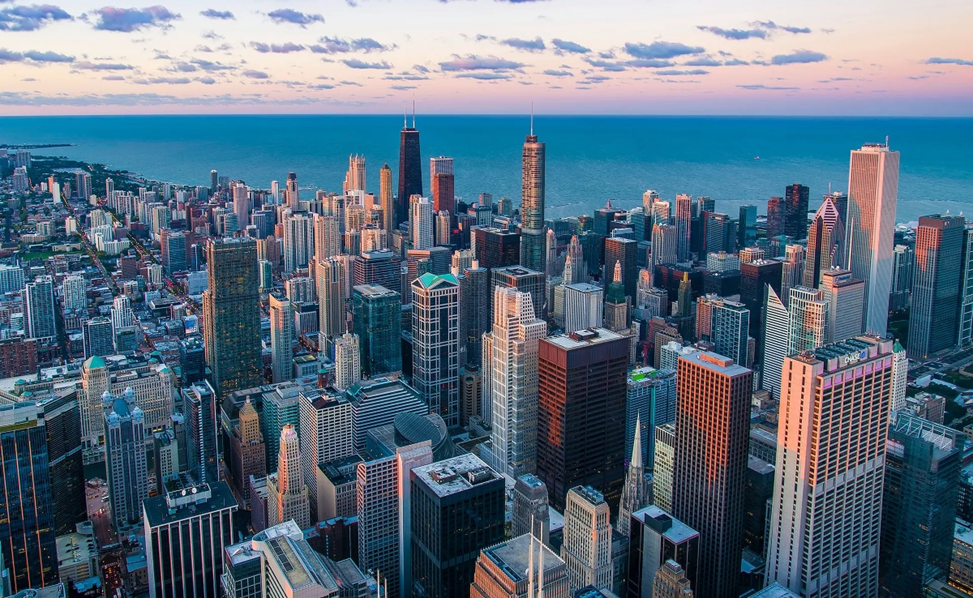 Chicago skyline at sunset over Lake Michigan, home to VDB Asset Management's global headquarters and its multifamily investment platform.